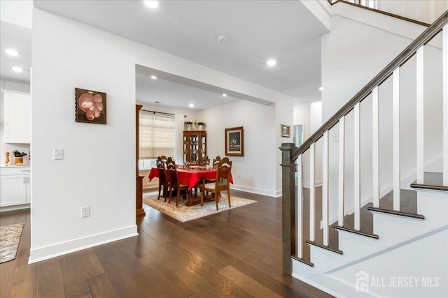 dining area with dark hardwood / wood-style flooring