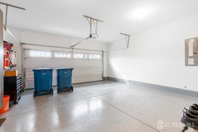 garage with a garage door opener and electric panel