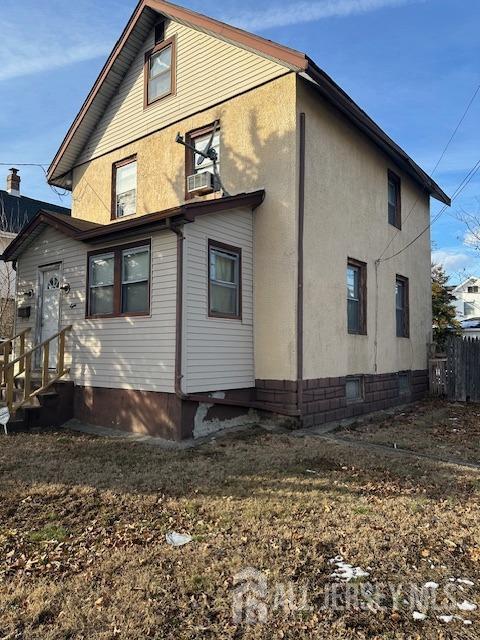 8 E Germantown Ave E, Edison, NJ 08817 - view of home's exterior featuring crawl space, entry steps, and stucco siding