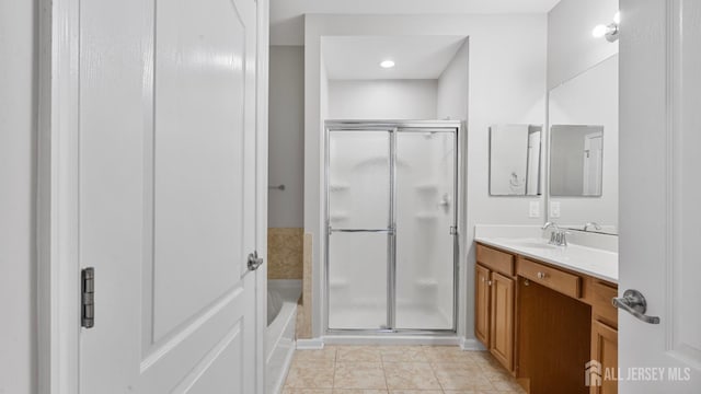2024 Edward Stec Blvd, Edison, NJ 08837 - full bath with vanity, a shower stall, a garden tub, and tile patterned floors