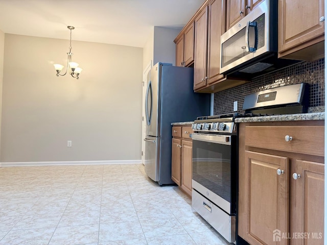 2024 Edward Stec Blvd, Edison, NJ 08837 - kitchen with appliances with stainless steel finishes, a chandelier, decorative backsplash, hanging light fixtures, and stone countertops