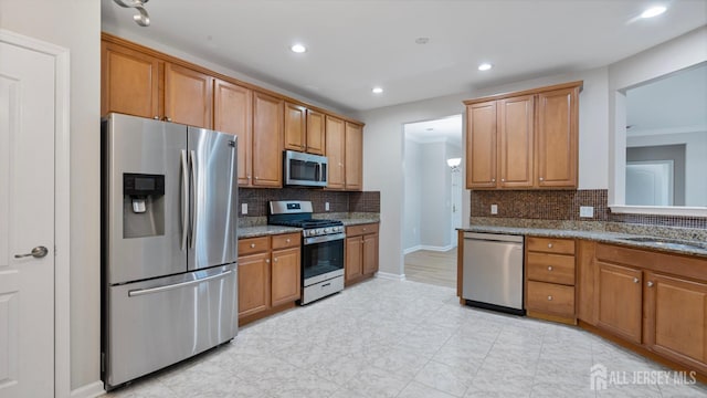 2024 Edward Stec Blvd, Edison, NJ 08837 - kitchen featuring appliances with stainless steel finishes, tasteful backsplash, brown cabinets, and recessed lighting