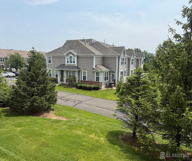 2024 Edward Stec Blvd, Edison, NJ 08837 - view of front facade featuring a front yard and brick siding
