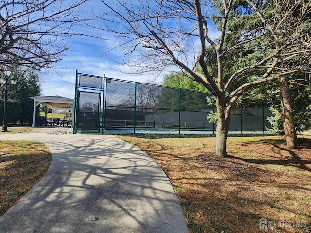 309-C Sharon Way, Monroe, NJ 08831 - view of home's community with a gate, fence, and a tennis court