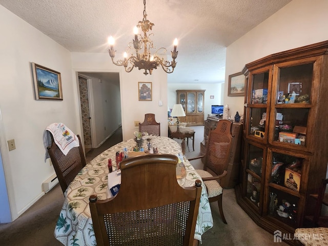 309-C Sharon Way, Monroe, NJ 08831 - carpeted dining area with baseboard heating, a chandelier, and a textured ceiling