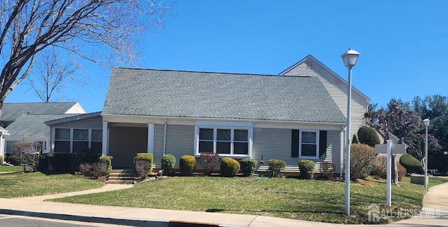 309-C Sharon Way, Monroe, NJ 08831 - view of front of house featuring a front yard and a shingled roof