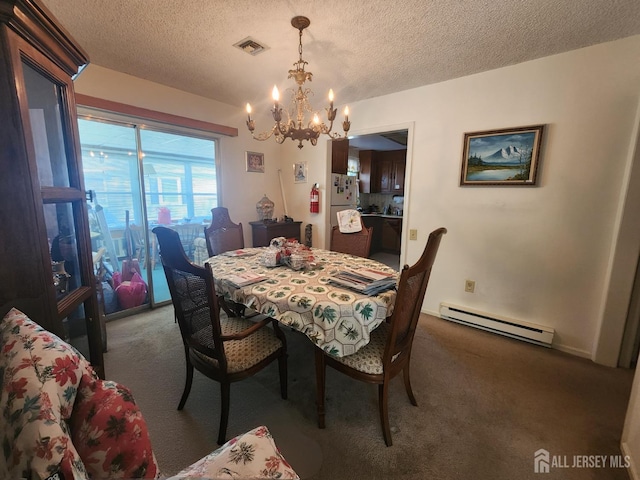 309-C Sharon Way, Monroe, NJ 08831 - dining area with baseboard heating, carpet, a chandelier, and a textured ceiling