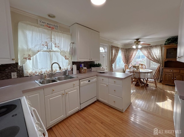 1515 Thomas Ave, North Brunswick, NJ 08902 - kitchen featuring white appliances, a sink, crown molding, decorative backsplash, and white cabinetry