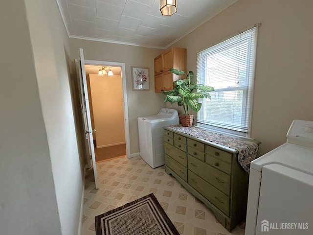 1515 Thomas Ave, North Brunswick, NJ 08902 - laundry area featuring separate washer and dryer, ornamental molding, cabinet space, and baseboards