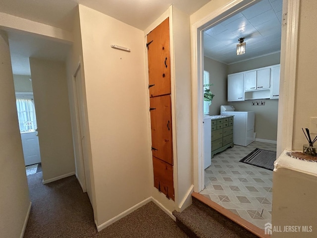 1515 Thomas Ave, North Brunswick, NJ 08902 - corridor featuring washer and dryer, baseboards, ornamental molding, and light colored carpet