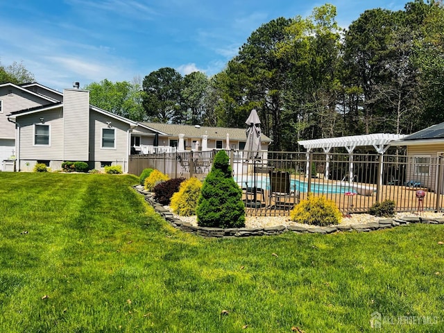 exterior space featuring fence, a fenced in pool, and a lawn