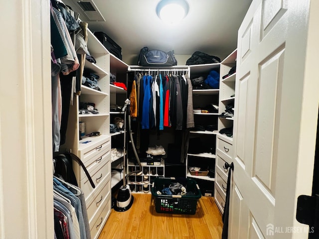 spacious closet with visible vents and light wood-style flooring