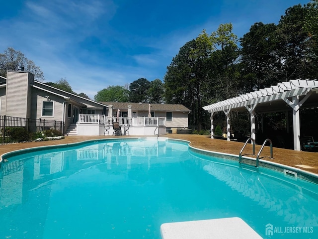 view of swimming pool with fence, a pergola, and a fenced in pool