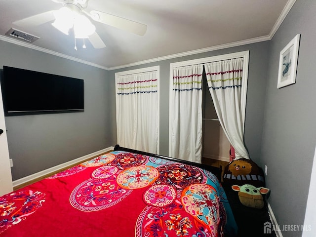 bedroom with baseboards, ceiling fan, crown molding, and visible vents