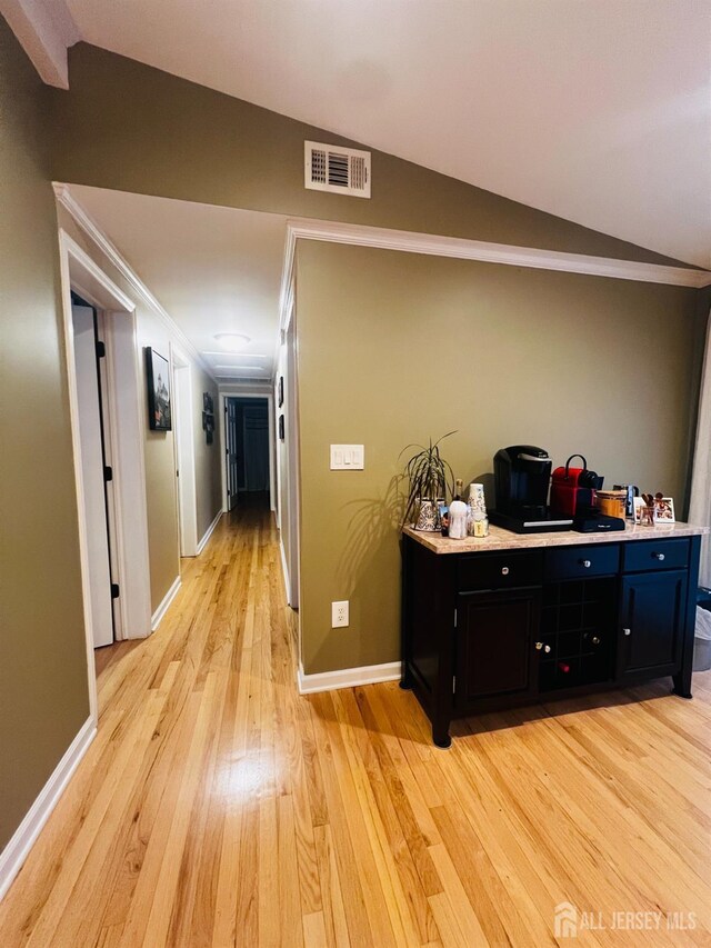 195 Old Forge Rd, Monroe, NJ 08831 - corridor with light wood finished floors, lofted ceiling, and ornamental molding