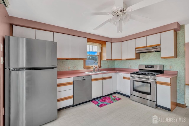 250 Adirondack Ave, Spotswood, NJ 08884 - kitchen featuring appliances with stainless steel finishes, under cabinet range hood, white cabinets, and light countertops