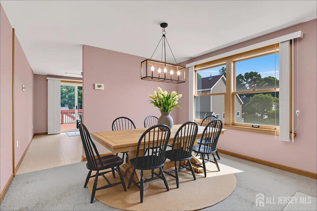 250 Adirondack Ave, Spotswood, NJ 08884 - dining space featuring a chandelier and baseboards
