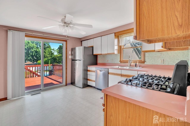 250 Adirondack Ave, Spotswood, NJ 08884 - kitchen with stainless steel appliances, plenty of natural light, light countertops, and ceiling fan
