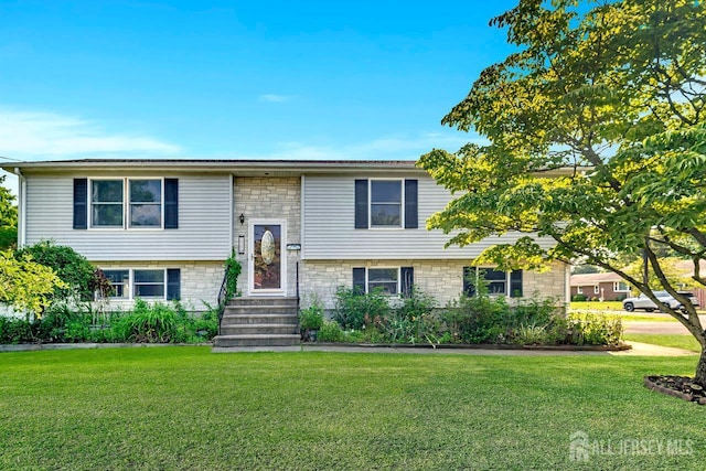 250 Adirondack Ave, Spotswood, NJ 08884 - split foyer home featuring a front yard and stone siding