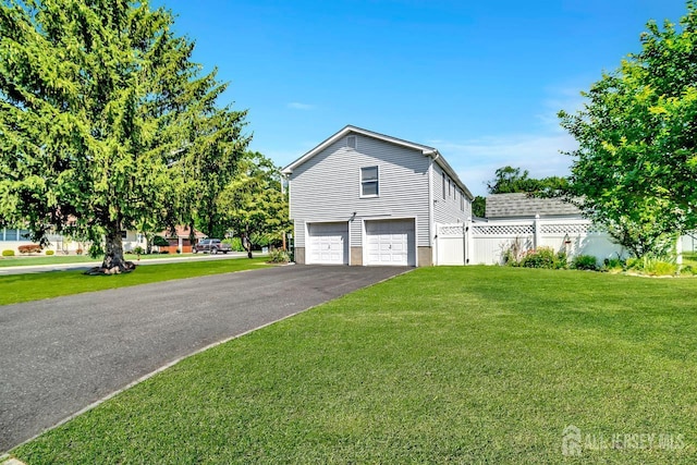 250 Adirondack Ave, Spotswood, NJ 08884 - view of property exterior with asphalt driveway and an attached garage