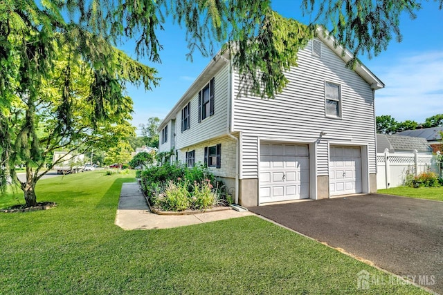 250 Adirondack Ave, Spotswood, NJ 08884 - view of side of home with an attached garage and asphalt driveway