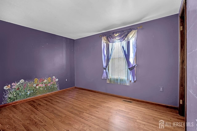 250 Adirondack Ave, Spotswood, NJ 08884 - spare room with wood finished floors and baseboards