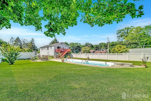 250 Adirondack Ave, Spotswood, NJ 08884 - fenced backyard featuring a wooden deck, a patio area, and stairs