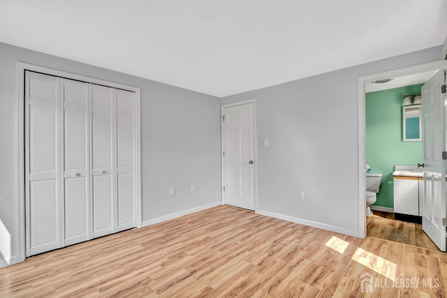 250 Adirondack Ave, Spotswood, NJ 08884 - unfurnished bedroom with light wood-style floors, a closet, and ensuite bathroom