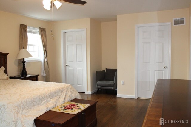 bedroom featuring ceiling fan and dark hardwood / wood-style floors