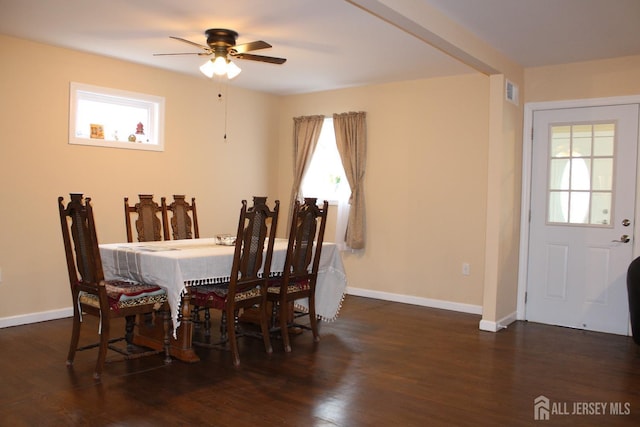 dining space with dark wood-type flooring and ceiling fan