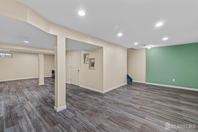 finished basement with dark wood-style floors, recessed lighting, and baseboards