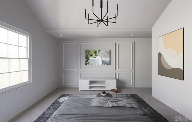 bedroom with a notable chandelier and vaulted ceiling