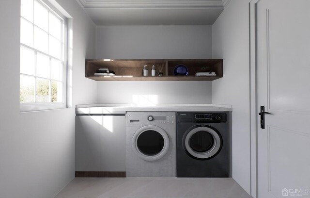 laundry area featuring washing machine and clothes dryer