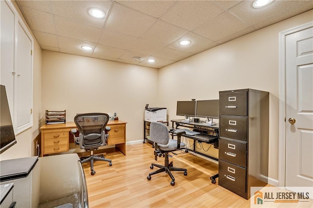 office area featuring recessed lighting, a drop ceiling, and wood finished floors