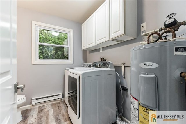 laundry room with water heater, laundry area, wood finished floors, washer and dryer, and a baseboard radiator