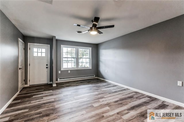 entryway featuring a baseboard radiator, baseboards, and wood finished floors