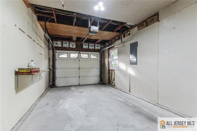 garage with electric panel and a garage door opener