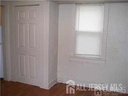 19 Haag St, Sayreville, NJ 08872 - empty room with wood finished floors and baseboards