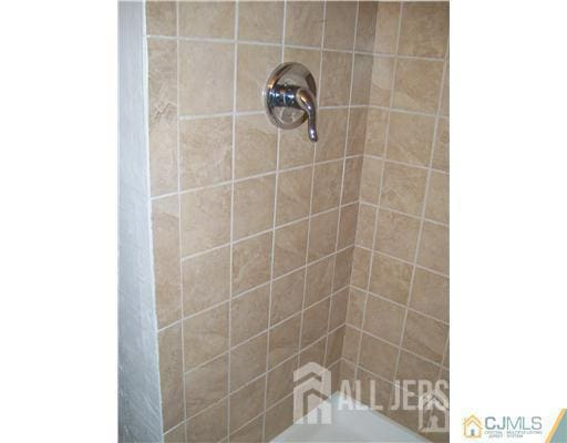 19 Haag St, Sayreville, NJ 08872 - bathroom featuring tiled shower