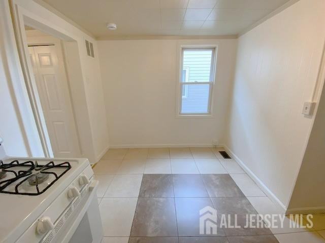19 Haag St, Sayreville, NJ 08872 - unfurnished room with light tile patterned floors and ornamental molding