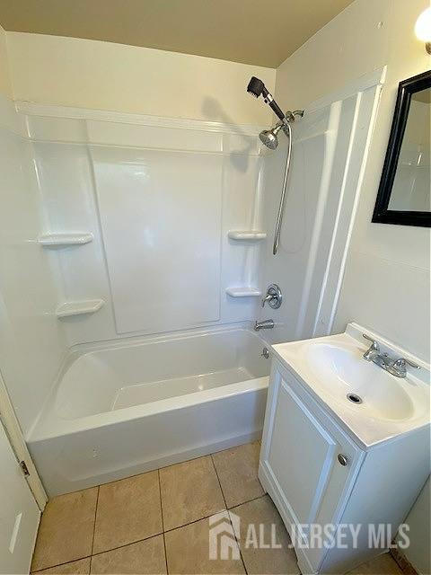 19 Haag St, Sayreville, NJ 08872 - full bath featuring tile patterned flooring, vanity, and bathing tub / shower combination