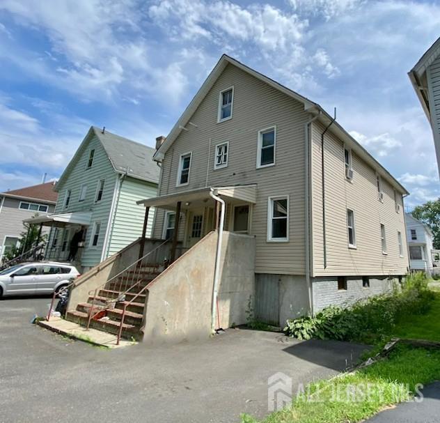 19 Haag St, Sayreville, NJ 08872 - view of front of house featuring stairway and a porch