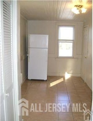 19 Haag St, Sayreville, NJ 08872 - kitchen featuring freestanding refrigerator, tile patterned flooring, and wood ceiling
