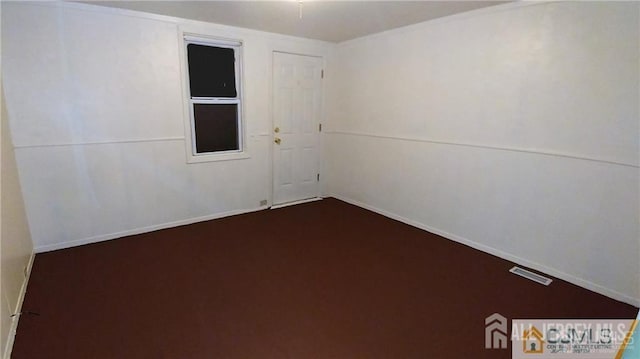 19 Haag St, Sayreville, NJ 08872 - unfurnished room with dark carpet and baseboards