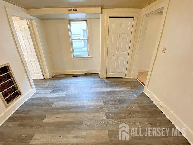 19 Haag St, Sayreville, NJ 08872 - unfurnished bedroom featuring wood finished floors and a closet
