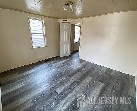 19 Haag St, Sayreville, NJ 08872 - empty room with dark wood finished floors