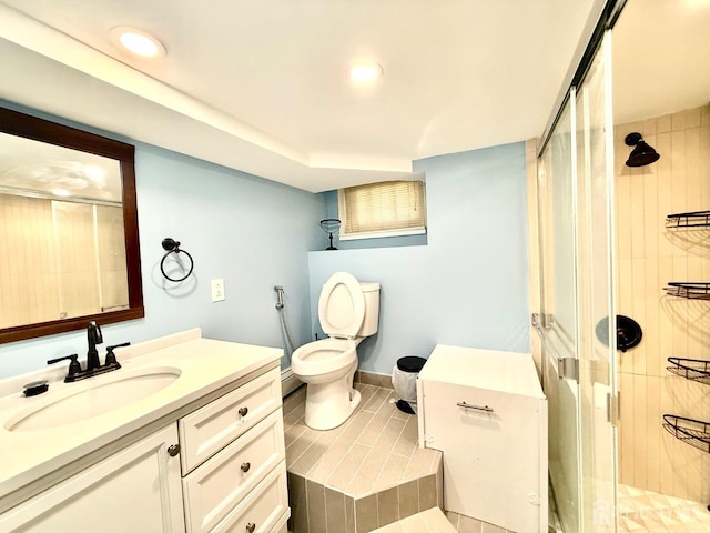 bathroom with recessed lighting, toilet, a stall shower, and vanity