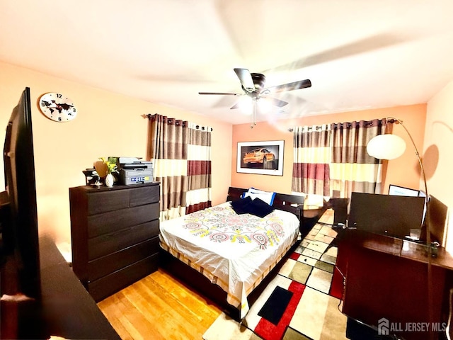 bedroom with wood finished floors