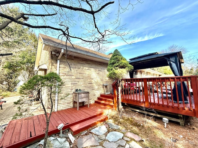 wooden deck with a gazebo