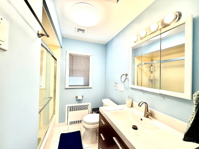 bathroom with vanity, radiator, visible vents, a stall shower, and tile patterned flooring